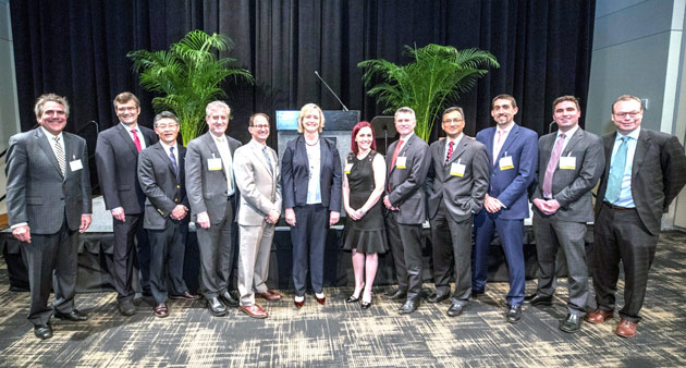 L-r: Eric Johnson, Björn Knollmann, Dai Chung, Dan Roden, Russell Rothman, Susan Wente, Carrie Kitko, Dane Chetkovich, Rangaraj Ramanujam, Timothy Vogus, Berk Sensoy and Jeff Balser. (John Russell/Vanderbilt)