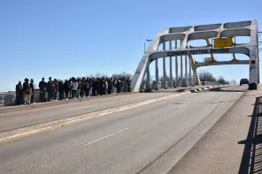 Students and chaperones walking across the Edmund Pettus Bridge, the historic site from Bloody Sunday.