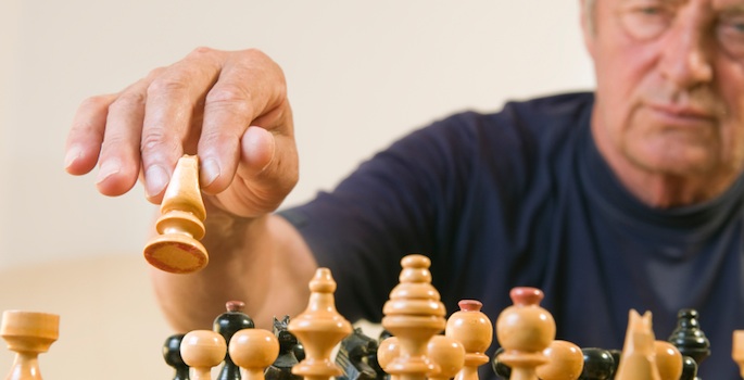 Older man playing chess