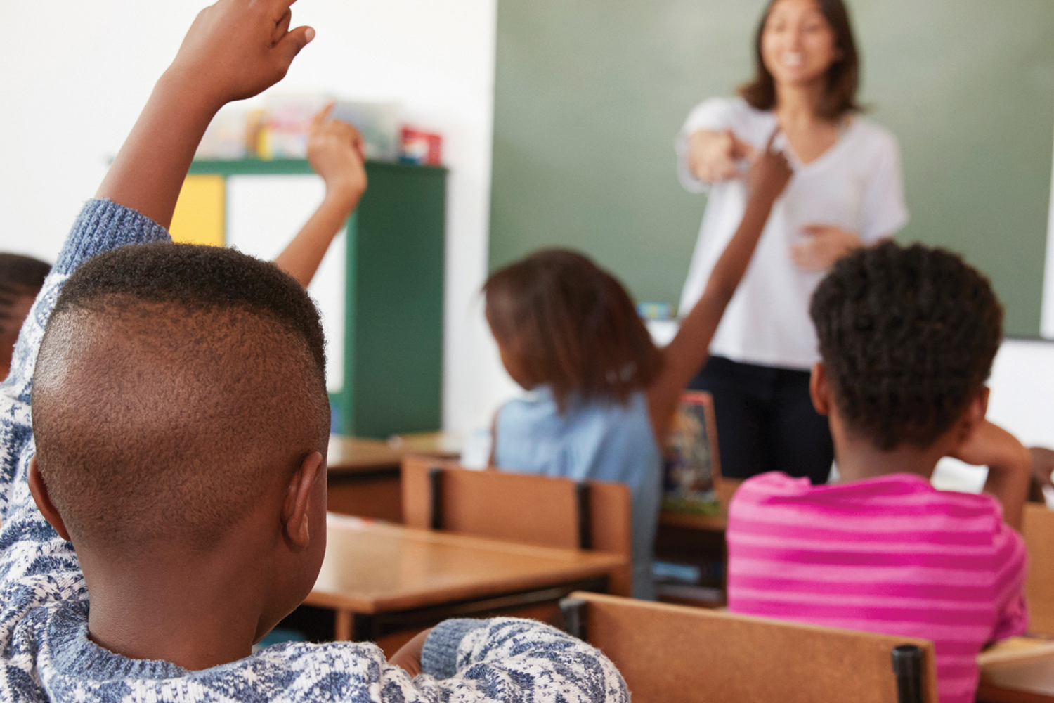 photo of a teacher leading a classroom of African American students