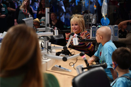 During her visit to Monroe Carell Jr. Children’s Hospital at Vanderbilt, country music legend Dolly Parton took part in an on-air interview at Seacrest Studios that was simulcast to four other children’s hospitals in the United States. (photo by Jason Davis/Getty Images)