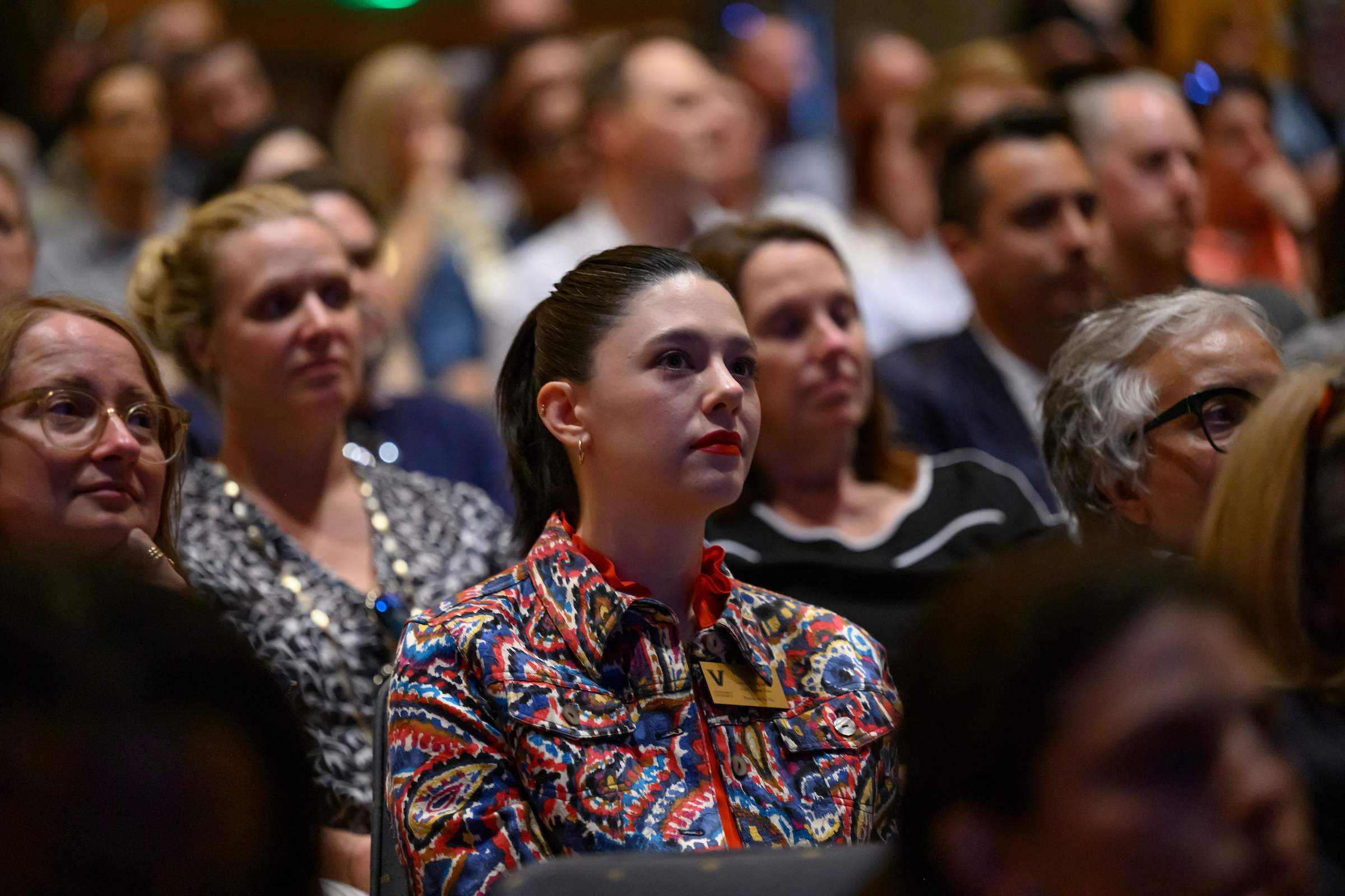 A crowd of people seated in an auditorium