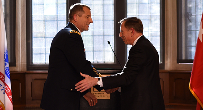 Former CIA Director and retired Army Gen. David Petraeus (right) congratulates Vanderbilt alumnus Maj. Gen. William “Bill” Hickman, BS’83, MBA’92, on his upcoming retirement from the U.S. Army. (Adrienne Burns/Vanderbilt)