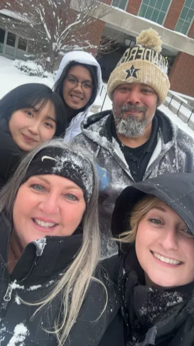 Campus Dining workers pause their hard work for a selfie in the snow.