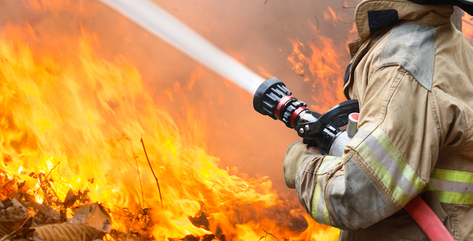 firefighters battle a wildfire