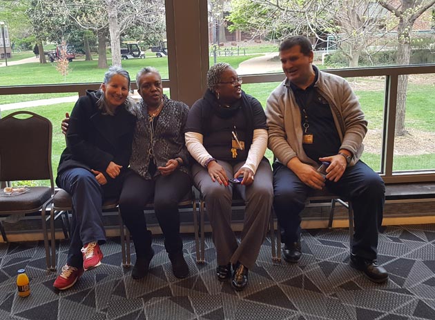 Gloria Smith (second from left), inaugural recipient of the Staff Diversity Award, and Interim Vice Chancellor for Equity, Diversity and Inclusion Tina Smith (second from right) spend time with the Plant Ops staff. (Vanderbilt University)
