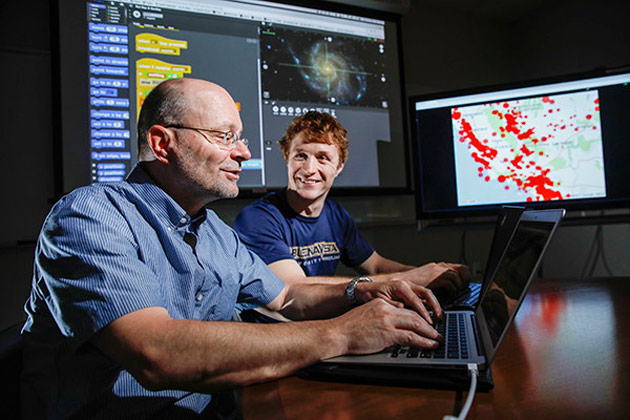 Professor Akos Ledeczi and Ph.D. student Brian Broll work with their NetsBlox intuitive visual programming platform. (Vanderbilt University)