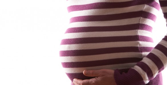 belly of pregnant woman pregnant belly - striped shirt