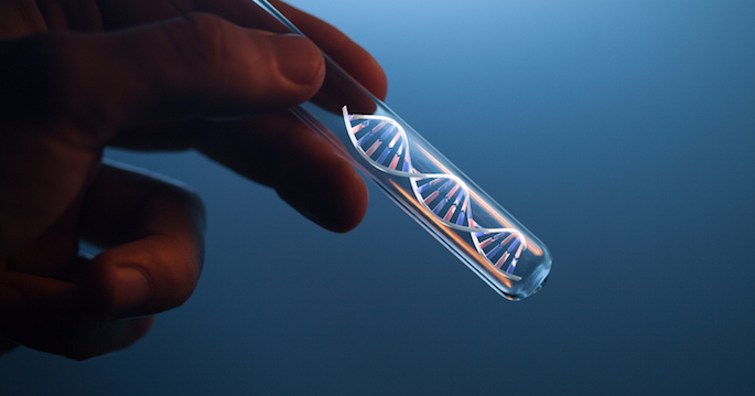 DNA molecule in glass tube in hand of scientist on blue
