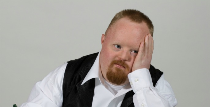 Man with Down syndrome thinking