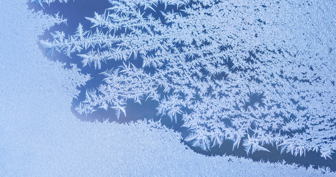 window in the process of freezing over