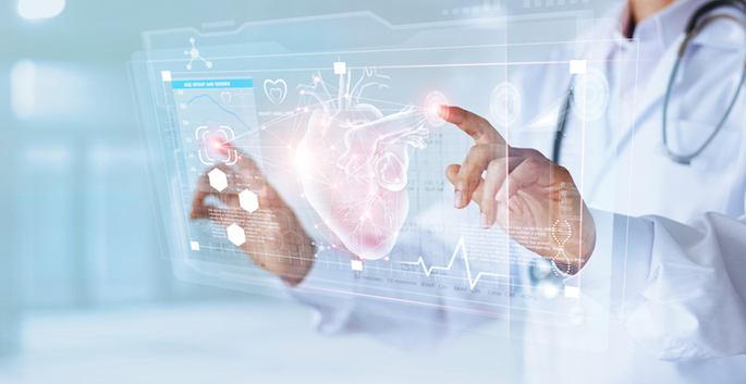 Doctor's hands touching virtual reality diagram of heart on glass screen