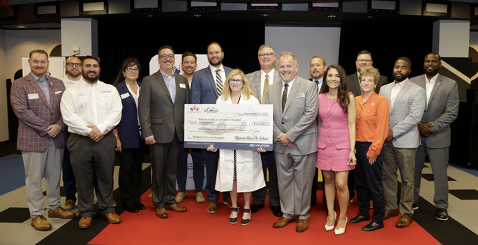 Debra Friedman, MD, MS, center, with representatives from Hyundai Motor America and local dealerships. (photo by Donn Jones)
