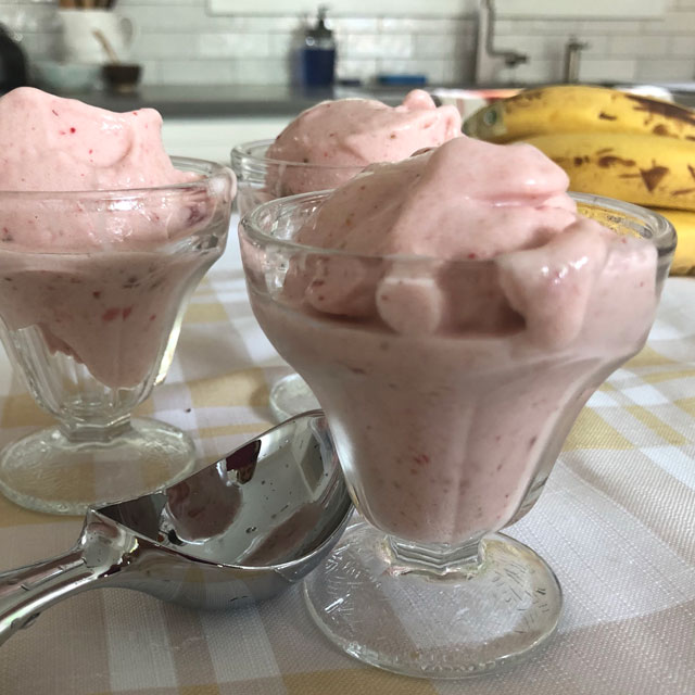 Two parfait glasses filled with homemade faux ice cream