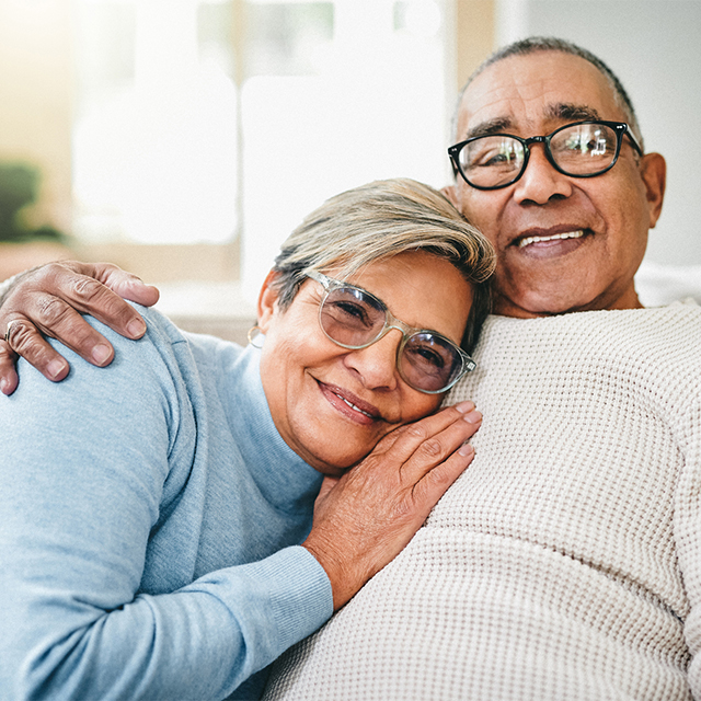 Happy older couple cuddling