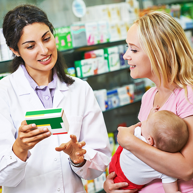 family being helped at pharmacy