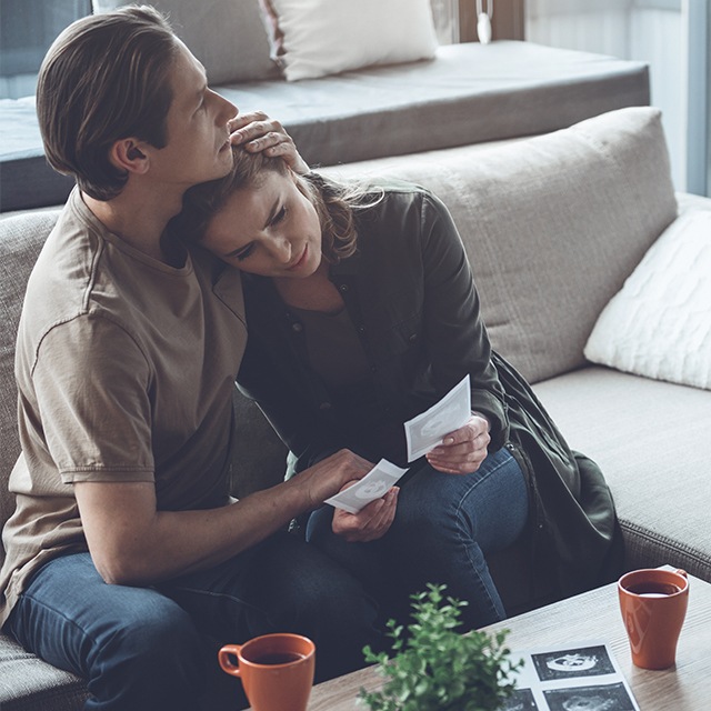 Man comforting woman