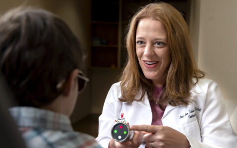 Lori Ann Kehler, O.D., in clinic with a patient