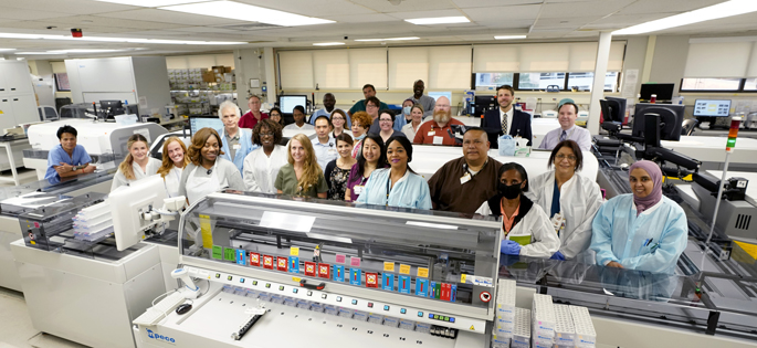 Core Clinical Chemistry Lab staff members gathered recently to mark the launch of a faster, higher-volume automated chemistry line.