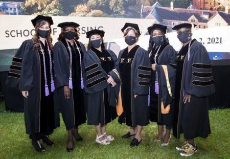 From left, DNP graduates Andrea Taylor, LaGaunda Jones, Marigene McNicholl, Shelby DeWitt, Yasmine Mathews and Gwendolyn Godlock pose for a photo before the School of Nursing ceremony.
