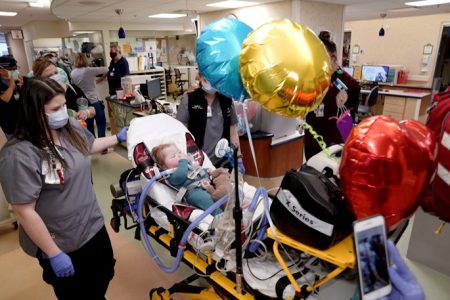 On April 27, Carter Ray was finally able to leave the hospital for the first time since he was born 17 months ago. Here, Children’s Hospital personnel celebrate the milestone. 