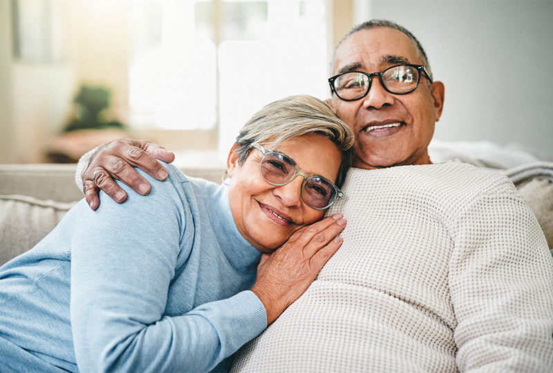 Happy older couple cuddling