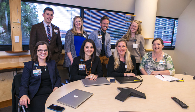 A Population Health Pharmacy Team at Vanderbilt Health is piloting a program that decreases medication errors after hospital discharge. Seated, from left are, Michelle Griffith, MD; Erin Neal, PharmD, MMHC; Jennifer Booker, LCSW; and Janet Campbell, RN, BSN. Standing, from left, are Gary Owen, PharmD, MPH; Megan Monroe, PharmD; Chris Terry, PharmD, CDE; and Cate Mart, LMSW.