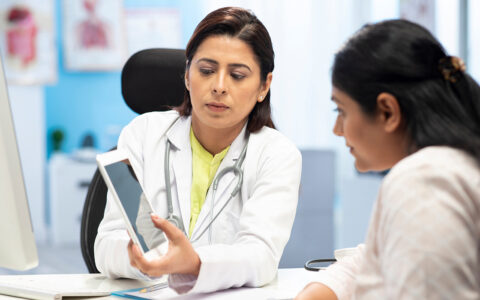 Doctor showing patient EHR results