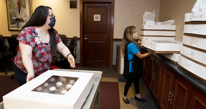 Angela Presti, left, and Erin Rothwell help distribute 3,000 cupcakes as part of celebrations for Monroe Carell Jr. Children’s Hospital at Vanderbilt’s strong showing in U.S. News & World Report’s ranking of America’s Best Children’s Hospitals.