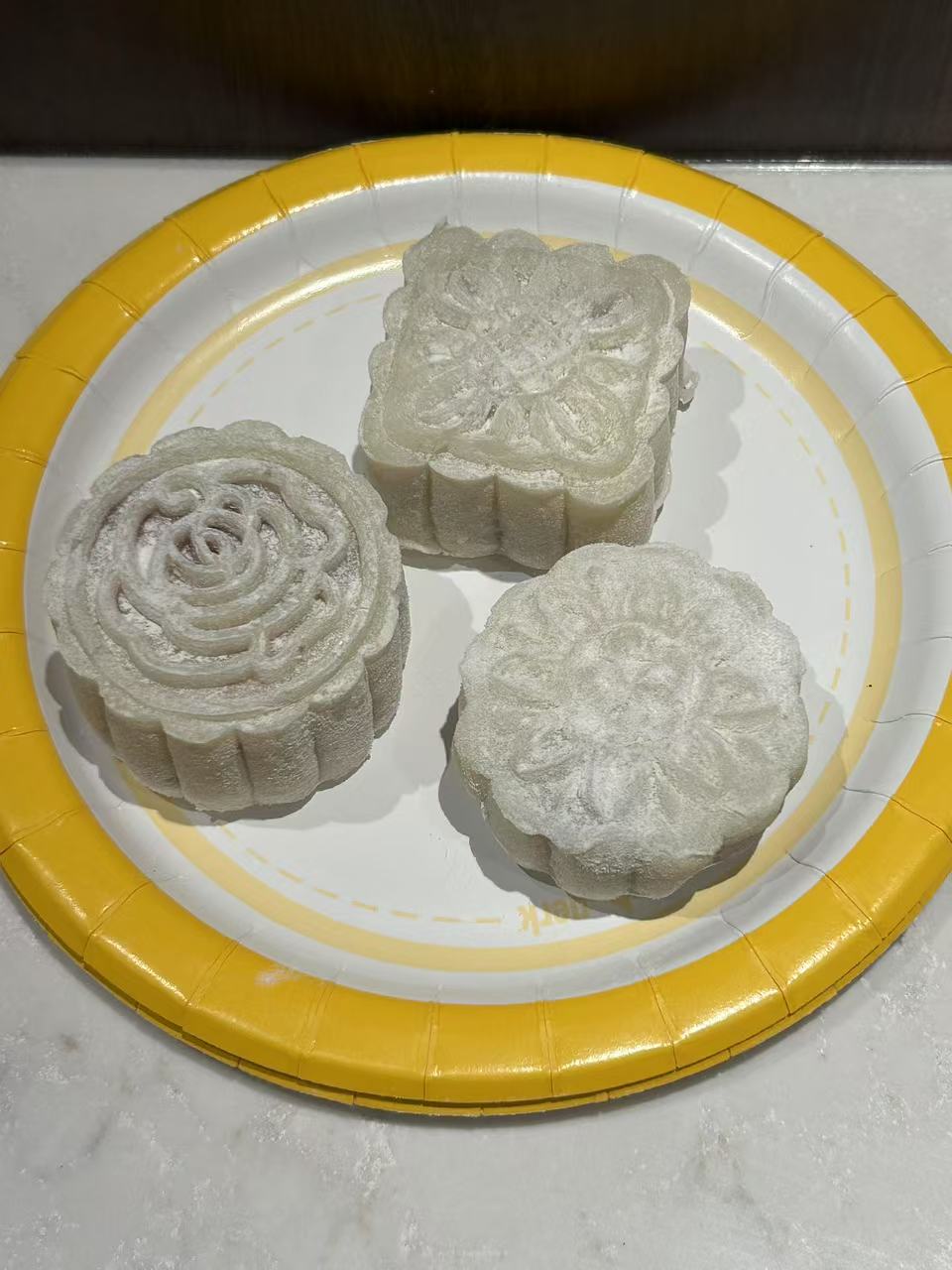 Mooncakes with intricate flower pattern stamped on top