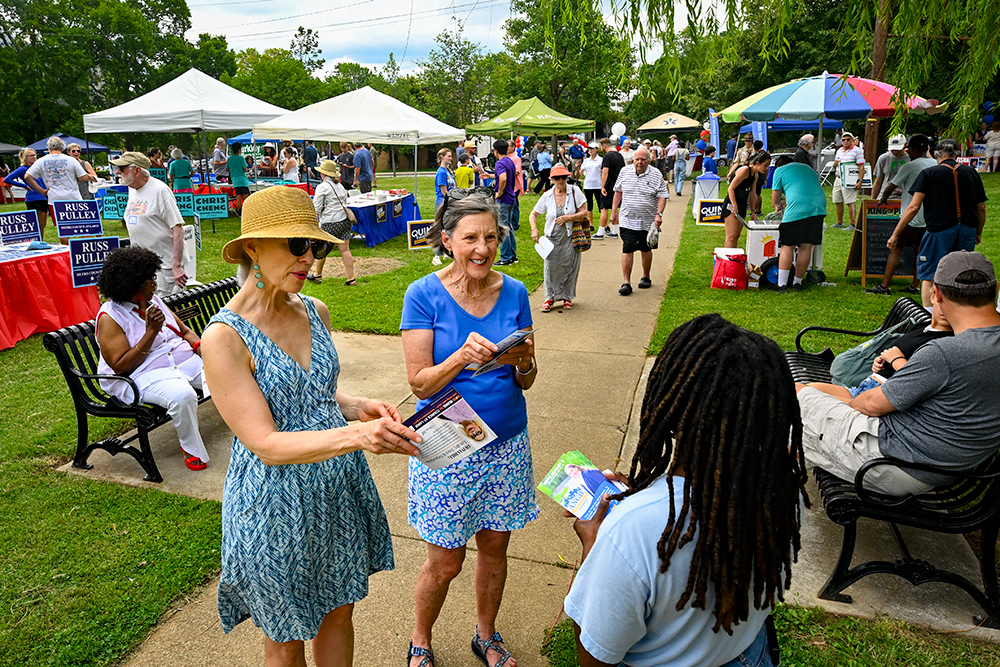 community members socializing at Candidate Meet and Greet in Fannie Mae Dees Park