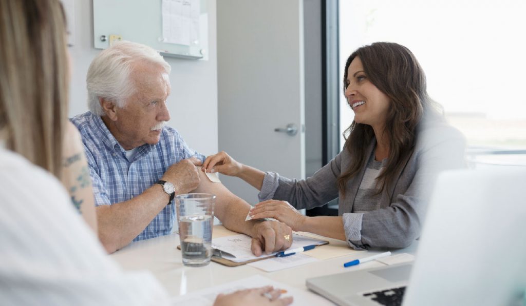 Doctor talking to elderly patient