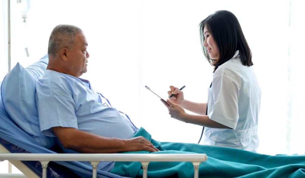 Patient and doctor speaking about heart failure treatment.