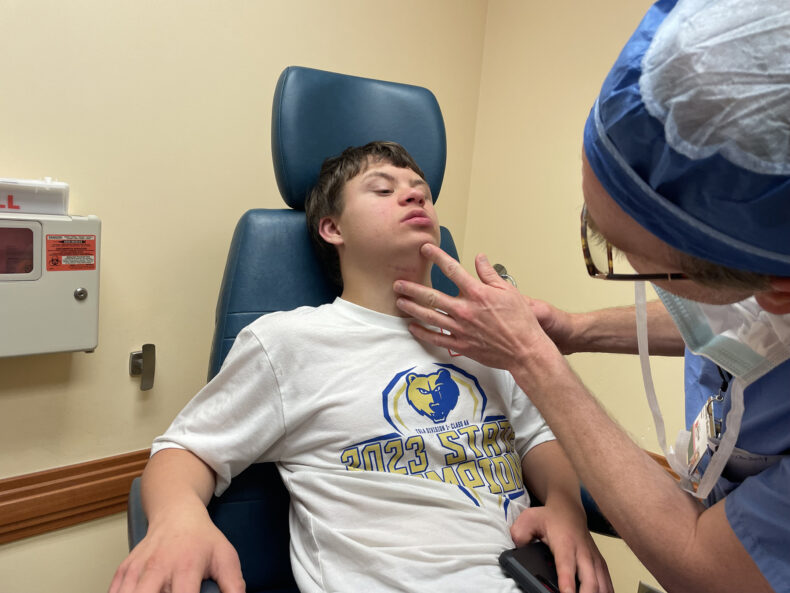 Christopher Wootten, MD, examines patient Jude Downer during an ear nose and throat visit. (photo by Jessica Pasley)