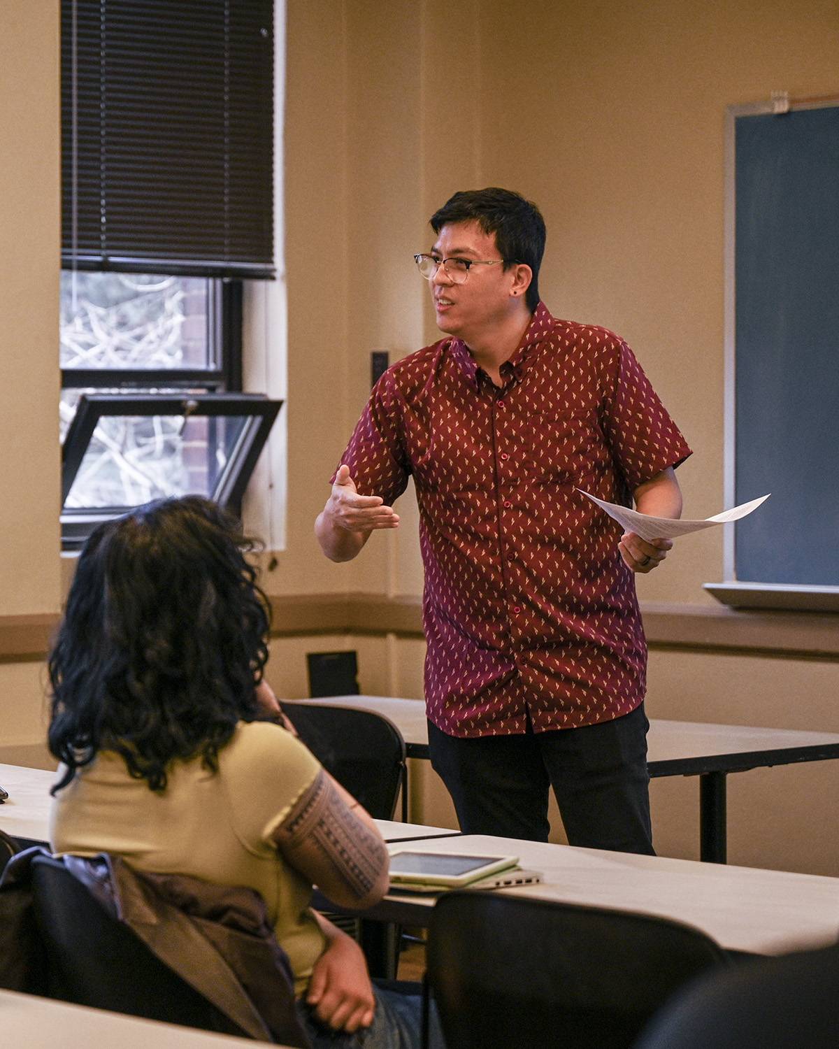professor in classroom mid-speech