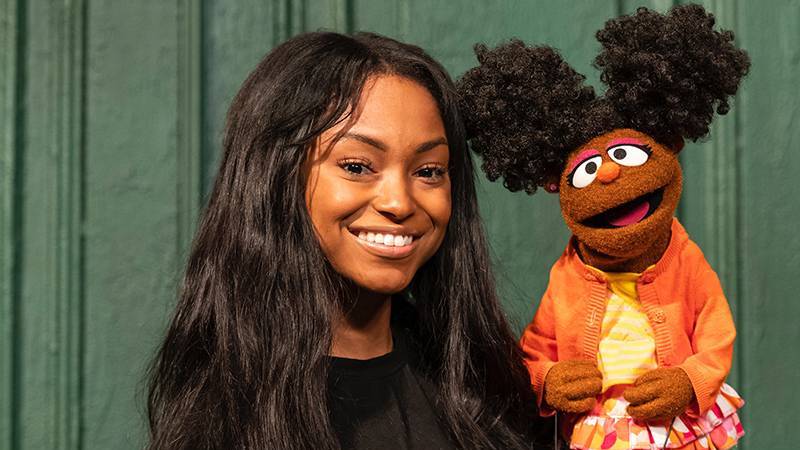 Megan Piphus Peace holding Sesame Street puppet