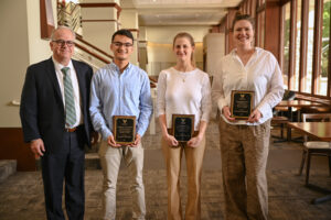 A photo of John McLean and the award winners.