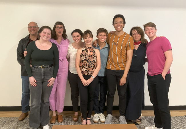 FRIT grads smiling together at camera