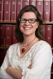 Woman with crossed arms smiling