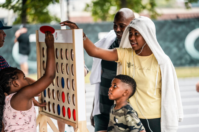 family playing connect four