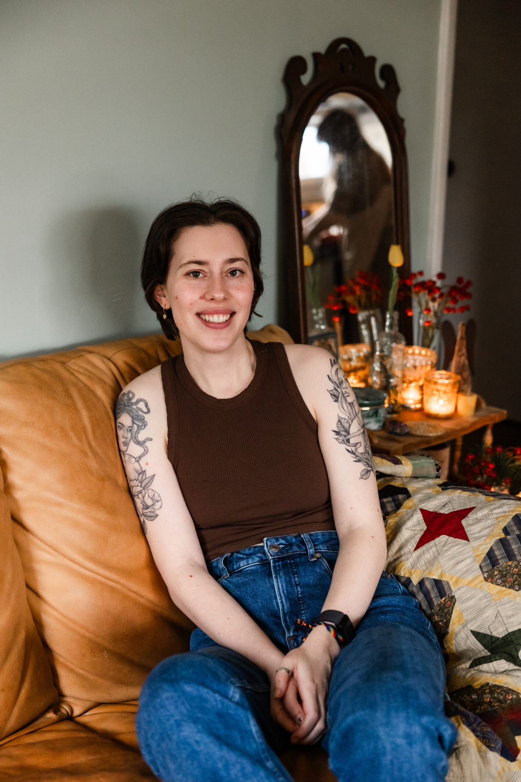 Marie-Claire Harrison sitting on a couch smiling