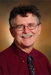 man in suit and tie smiling