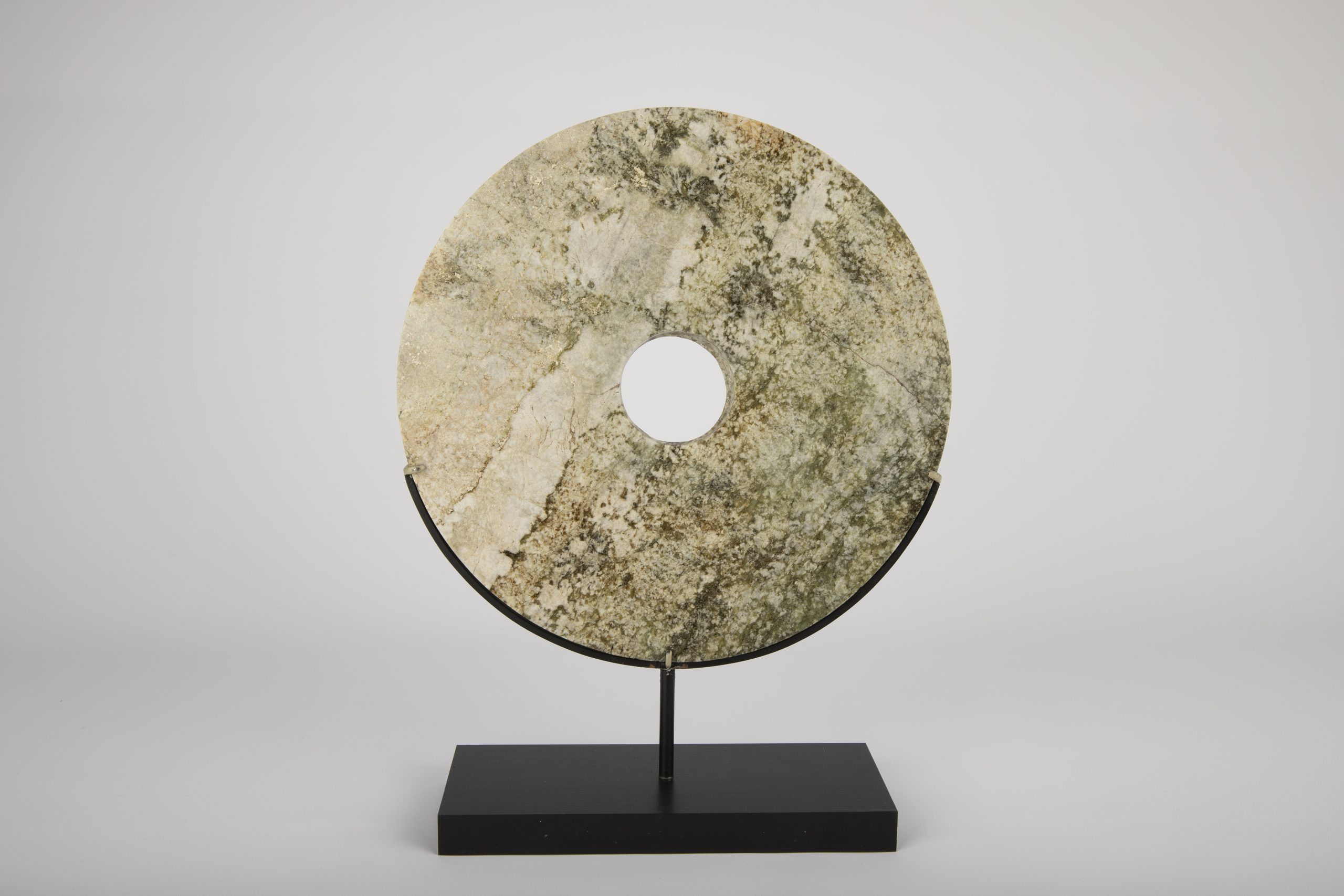 Artist Unknown (Lianzhu Culture, China) Bi disc, ca. 3300–2000 BCE  Nephrite Jade Gift of Chauncey P. Lowe Collection of Vanderbilt University Fine Arts Gallery  1999.138