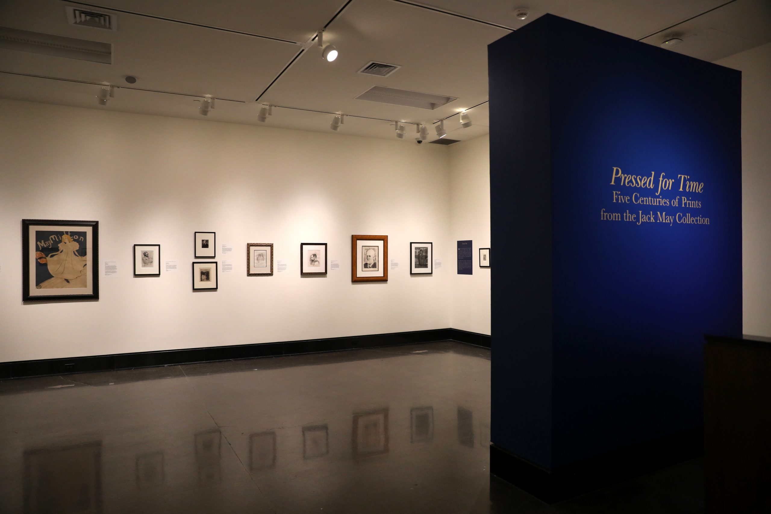 Interior of gallery with artworks hung on wall