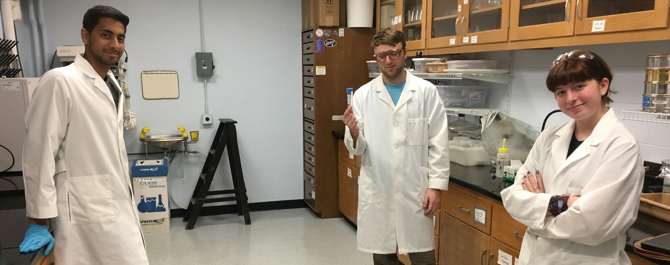 3 EES students in lab coats