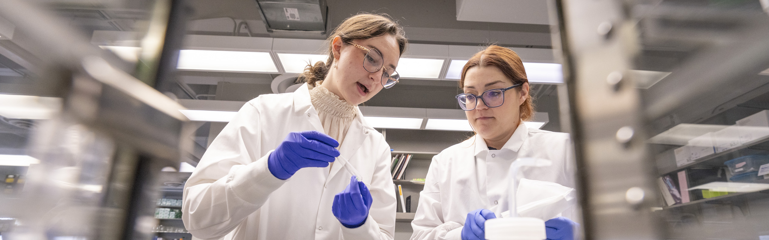 two students in conversation in a lab