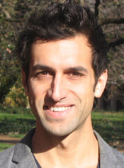 Gregory Leo standing outside with trees in background