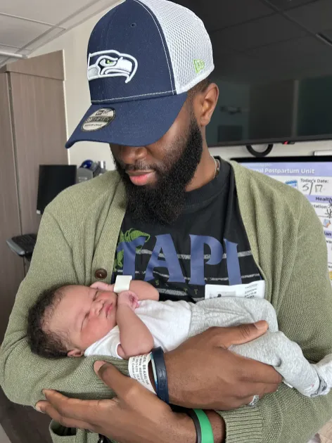 Malcolm Travis Brown and his son, Caleb, on the day Caleb was born (Submitted photo)