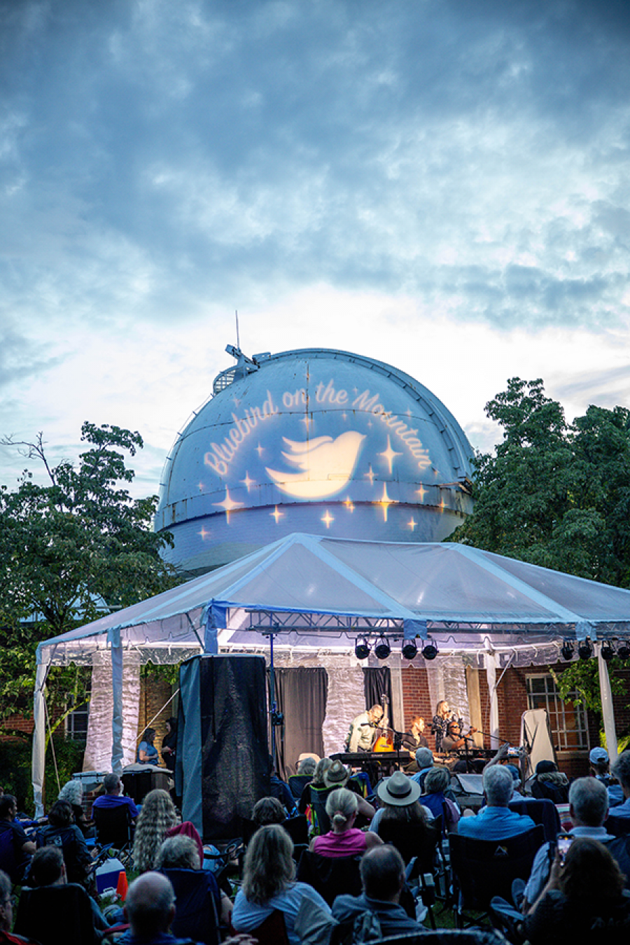 Audience enjoys a Bluebird on the Mountain concert outside Vanderbilt Dyer Observatory at dusk.