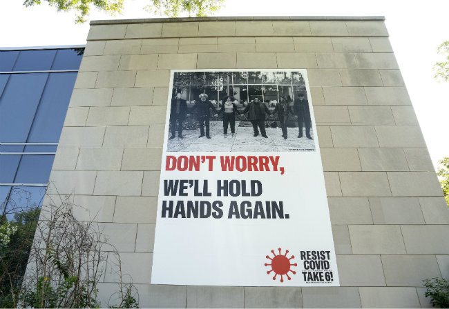 banner by artist Carrie Mae Weems on 21st Avenue Side of Cohen Memorial Hall